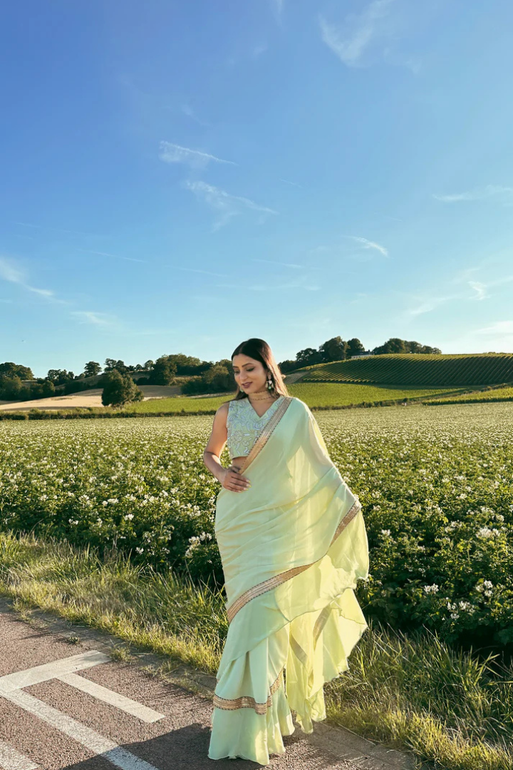 Ruffled Chiffon Saree and Exquisite Silk Blouse with Collar Embellishments