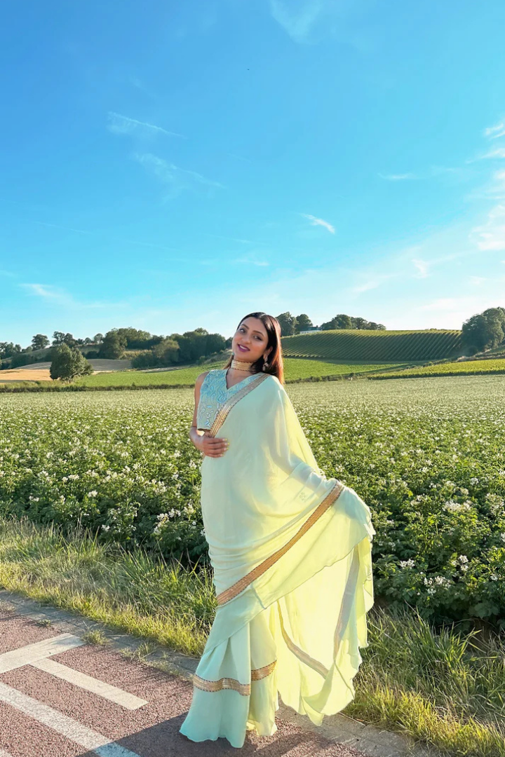 Ruffled Chiffon Saree and Exquisite Silk Blouse with Collar Embellishments